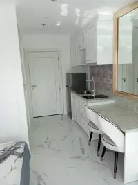 Studio Condo for Sale at The Empire Tower Pattaya kitchenette with mirror, sink and breakfast counter