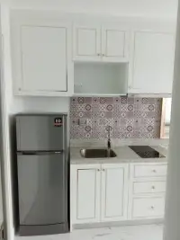 Studio Condo for Sale at The Empire Tower Pattaya compact kitchen with fridge, sink and stovetop