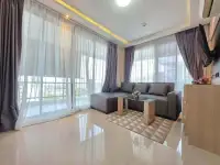 1 Bedroom Condo for Sale at Estanan Condo bright living room with floor-to-ceiling windows and city view