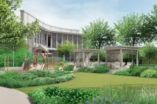 Patta Terrane outdoor garden with children's wooden playground, shaded pavilions, green lawn, and flowering landscaped borders
