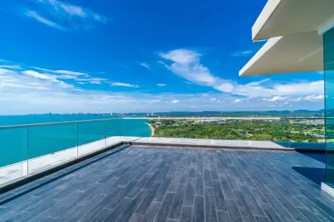 3 Bedroom Condo for Sale at Del Mare spacious wooden balcony terrace with glass railing and ocean view