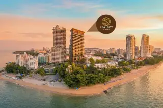Sea Sky by Sands aerial drone view of beachfront condo towers on Pattaya coastline at golden hour