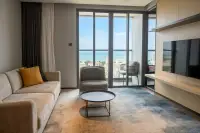 2 Bedroom Condo for Rent at Beverly Mountain Bay Pattaya living room with sofa, balcony and sea view