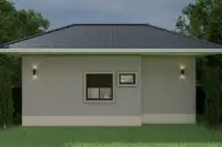 3 Bedroom House for Sale at Living 19 At Santisuk rear side wall exterior with wall lights bathroom windows at dusk