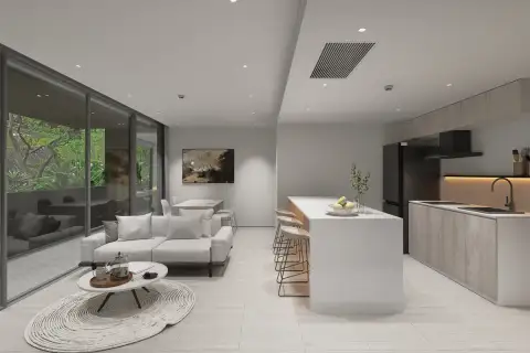 2 Bedroom Condo for Sale at Celine Wongamat bright open-plan living and kitchen area with floor-to-ceiling garden view windows