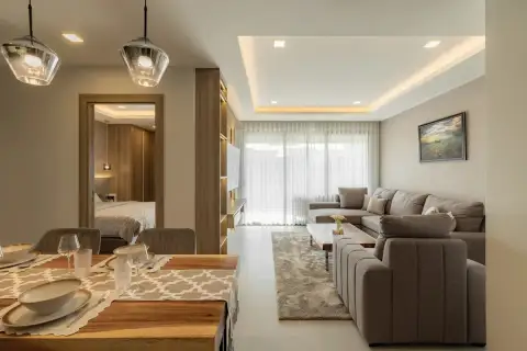 2 Bedroom Condo for Sale at Zensiri Estates and Residences dining area with wood table and pendant lights opening to living room and bedroom
