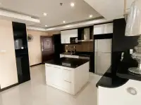 2 Bedroom Condo for Sale at PKCP Tower modern kitchen with black countertops, island, and built-in appliances