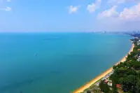 1 Bedroom Condo for Sale at Del Mare aerial view of turquoise Gulf of Thailand with sandy beach and Pattaya city skyline