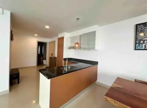 2 Bedroom Condo for Rent at Gardenia Pattaya kitchen counter with black granite top and wooden cabinets