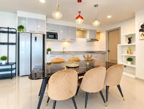 2 Bedroom Condo for Rent at Gardenia Pattaya kitchen and dining area with marble table and pendant lighting