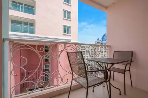 1 Bedroom Condo for Sale at Grande Caribbean balcony with patterned railing and outdoor seating