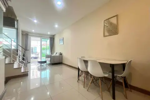 3 Bedroom House for Rent at Golden Town Pattaya open living and dining area with balcony access and staircase