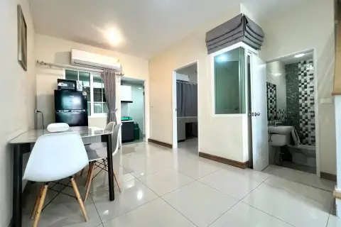 3 Bedroom House for Rent at Golden Town Pattaya kitchen area with dining table, appliances and bathroom entrance
