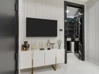 1 Bedroom Condo for Sale at Grand Solaire Noble high-rise tower illuminated at night with city skyline