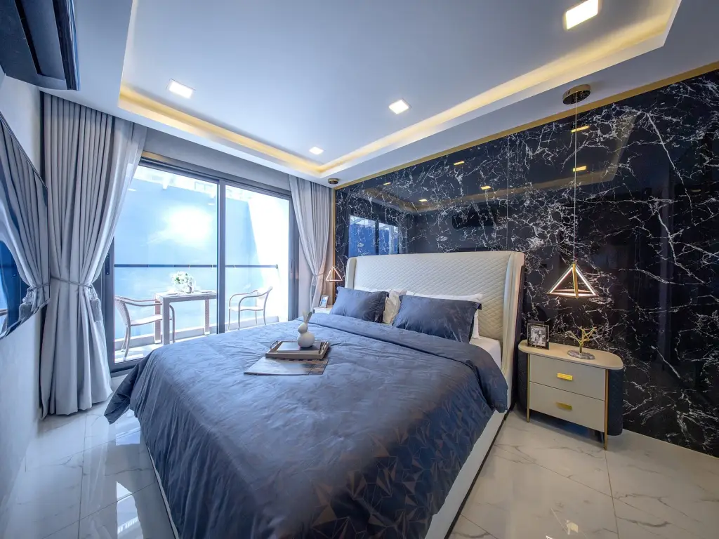 1 Bedroom Condo for Sale at Grand Solaire Noble bedroom with sea view, marble floors, and open kitchen