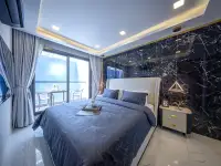 1 Bedroom Condo for Sale at Grand Solaire Noble bedroom with sea view, marble floors, and open kitchen
