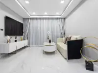 2 Bedroom Condo for Sale at Grand Solaire Noble open-plan living room with mirrored wall, sofa and ocean-view balcony