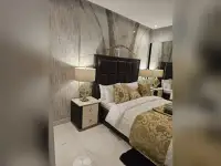 Studio Condo for Sale at Grand Solaire Noble living room with dining area and ocean view balcony