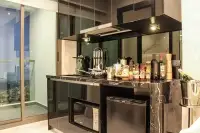 2 Bedroom Condo for Sale at Grand Solaire Pattaya compact kitchenette with microwave and mini fridge by window