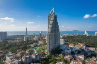 2 Bedroom Condo for Sale at Grand Solaire Pattaya distant view of the high-rise tower overlooking the sea and city skyline