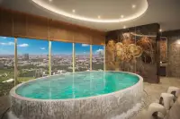 2 Bedroom Condo for Sale at Grand Solaire Pattaya rooftop infinity pool and lounge chairs with sea view
