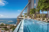 1 Bedroom Condo for Sale at Grand Solaire Pattaya distant view of the skyscraper overlooking the bay and shoreline