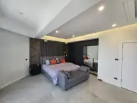 3 Bedroom Condo for Sale at Grand View Condo spacious bedroom with upholstered headboard and mirrored closet