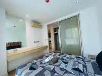 2 Bedroom Condo for Sale at Grande Caribbean bedroom with sliding closet doors and wall mirror