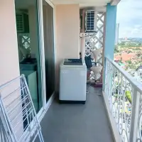 2 Bedroom Condo for Sale at Grande Caribbean balcony with washing machine and city view