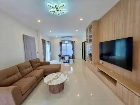 3 Bedroom House for Rent at H Living Life Chaipornwithi open-plan living and dining area with flat-screen TV