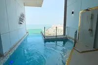 1 Bedroom Condo for Sale & Rent at Copacabana Beach Jomtien: Private plunge pool with an ocean and city skyline view.