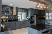4 Bedroom House for Sale at Hill View Villas gray kitchen with granite countertops and stainless steel appliances