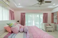 4 Bedroom House for Sale at Hill View Villas pink-themed bedroom with balcony and sheer curtains