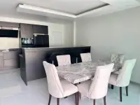 3 Bedroom House for Sale at Hillside Village Pattaya dining area with marble table and kitchen island view