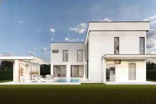 AVANI Pool Villa outdoor swimming pool area with lounge chairs, a large window facade, and lush greenery.