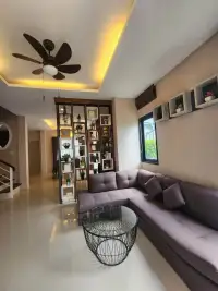 3 Bedroom House for Rent in Pong open living area with purple sectional sofa and ceiling fan