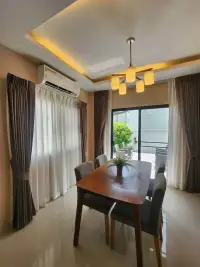 3 Bedroom House for Rent in Pong dining room with wooden table, chairs, and patio view