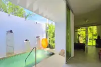 4 Bedroom House for Sale in Huai Yai poolside view with sliding glass doors opening to bedroom and garden