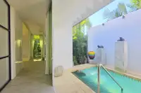 4 Bedroom House for Sale in Huai Yai hallway leading to outdoor plunge pool with decorative stone pillars