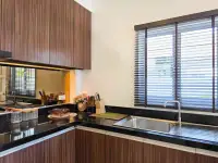 3 Bedroom House for Sale in Huai Yai modern kitchen with dark wood cabinets and granite countertops