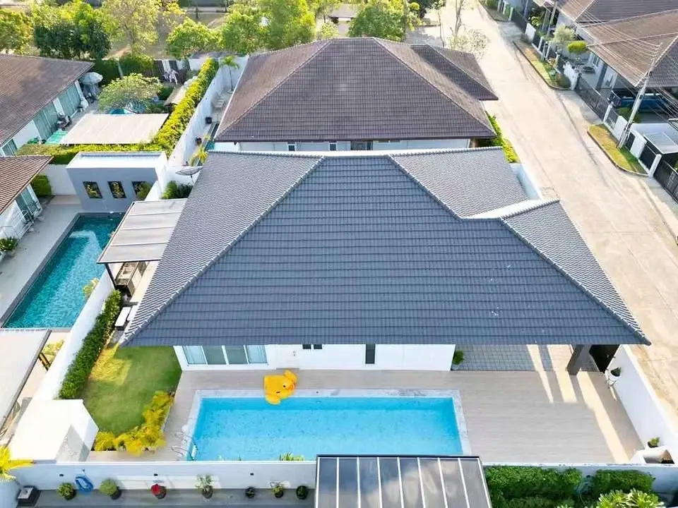 3 Bedroom House for Sale in Huai Yai aerial view of tiled roof home with private pool and sun deck