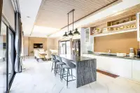 3 Bedroom House for Rent in Huai Yai modern kitchen with marble island and bar stools