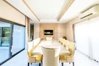 3 Bedroom House for Rent in Huai Yai formal dining room with long table seating ten