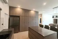 3 Bedroom House for Rent in Huai Yai modern kitchen with wood cabinetry, island, and fridge