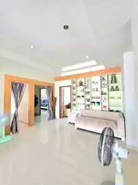 4 Bedroom House for Rent in Huai Yai open living space with shelving unit and hallway to bedrooms