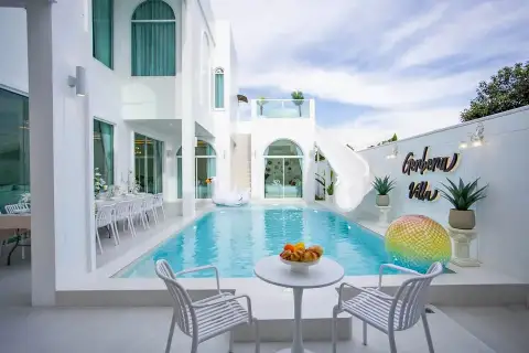 6 Bedroom House for Sale in Huai Yai poolside patio with dining table, pool floats and water slide