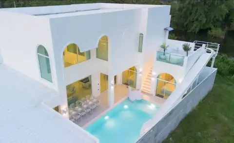 6 Bedroom House for Sale in Huai Yai aerial exterior view showing pool, slide and surrounding greenery