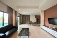 2 Bedroom House for Rent in Huai Yai open-plan living and dining area with pool view