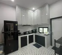3 Bedroom Townhouse for Rent in Huai Yai kitchen with white cabinets and black countertop stove