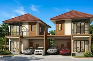 Baan Benjawan Grand modern townhouses with brown roofs, balconies, and covered carports with cars parked.